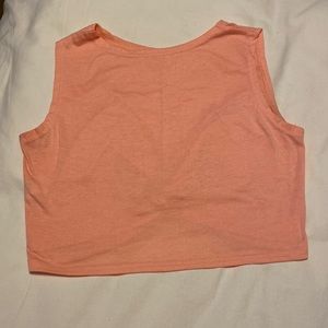 Peach colored cropped workout t shirt “gathered” knot in the back